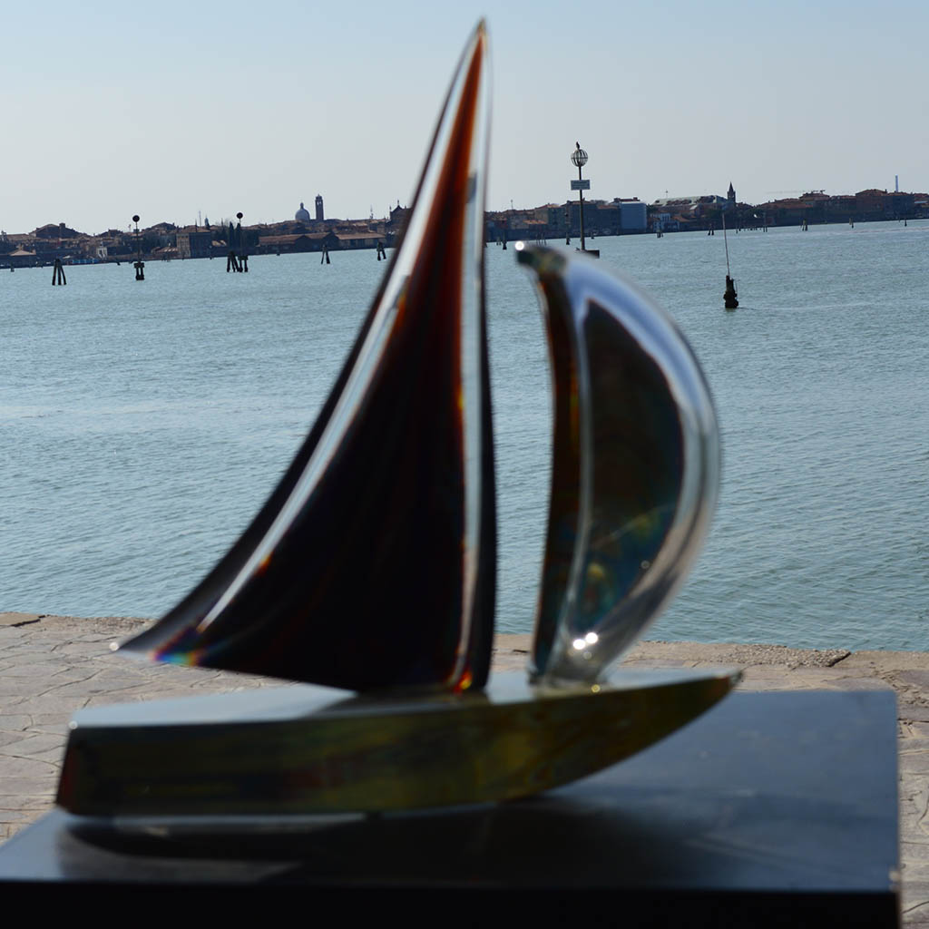 large glass sailboat sculpture